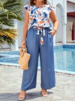 Conjunto Feminino Plus Size Lara, blusa com manga esvoaçante e calças ajustadas, estampa floral vibrante. Confortável e estiloso para um visual boho.