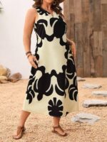 Vestido Plus Size Rafaella, estilo túnica, com decote V, estampa gráfica amarela, ajuste regular, ideal para ocasiões casuais e dias de sol.