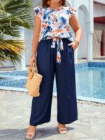 Conjunto Feminino Plus Size Lara, blusa com manga esvoaçante e calças ajustadas, estampa floral vibrante. Confortável e estiloso para um visual boho.