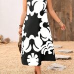 Vestido Plus Size Rafaella, estilo túnica, com decote V, estampa gráfica amarela, ajuste regular, ideal para ocasiões casuais e dias de sol.