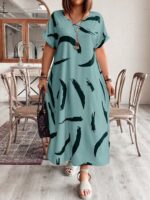 Vestido Plus Size Bruna Casual, estampa em blocos de cores, decote V, mangas morcego. Confortável e estiloso para diversas ocasiões.