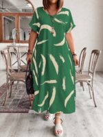 Vestido Plus Size Bruna Casual, estampa em blocos de cores, decote V, mangas morcego. Confortável e estiloso para diversas ocasiões.