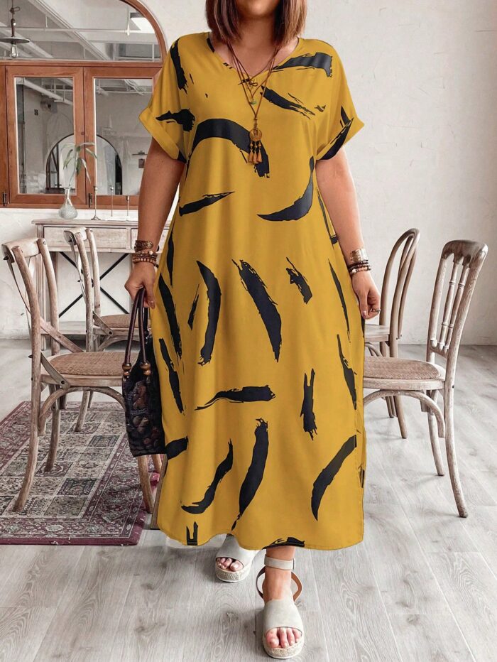 Vestido Plus Size Bruna Casual, estampa em blocos de cores, decote V, mangas morcego. Confortável e estiloso para diversas ocasiões.