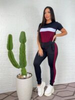 Conjunto feminino Ingrid com blusa listrada e calça com risca lateral, confeccionado em poliéster e elastano. Perfeito para um visual casual e moderno.
